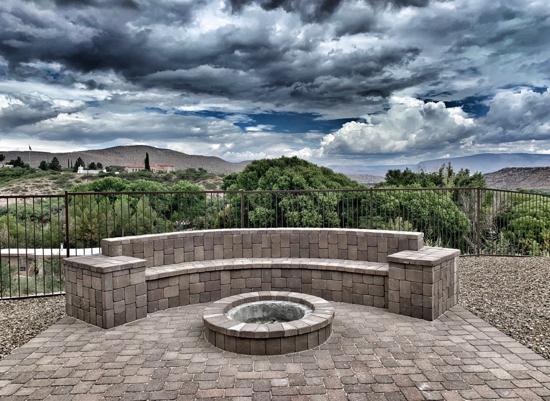 This picture is of a beautiful mason blocks creating a bench out of pavers.